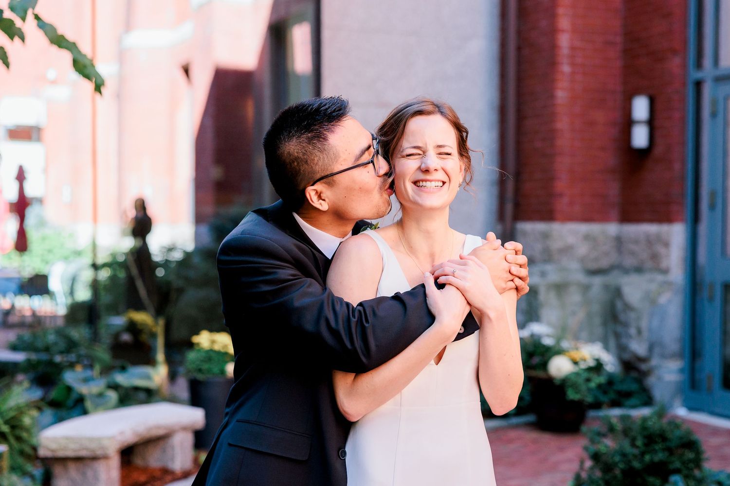 A groom hugs his bride during their first look ceremony.