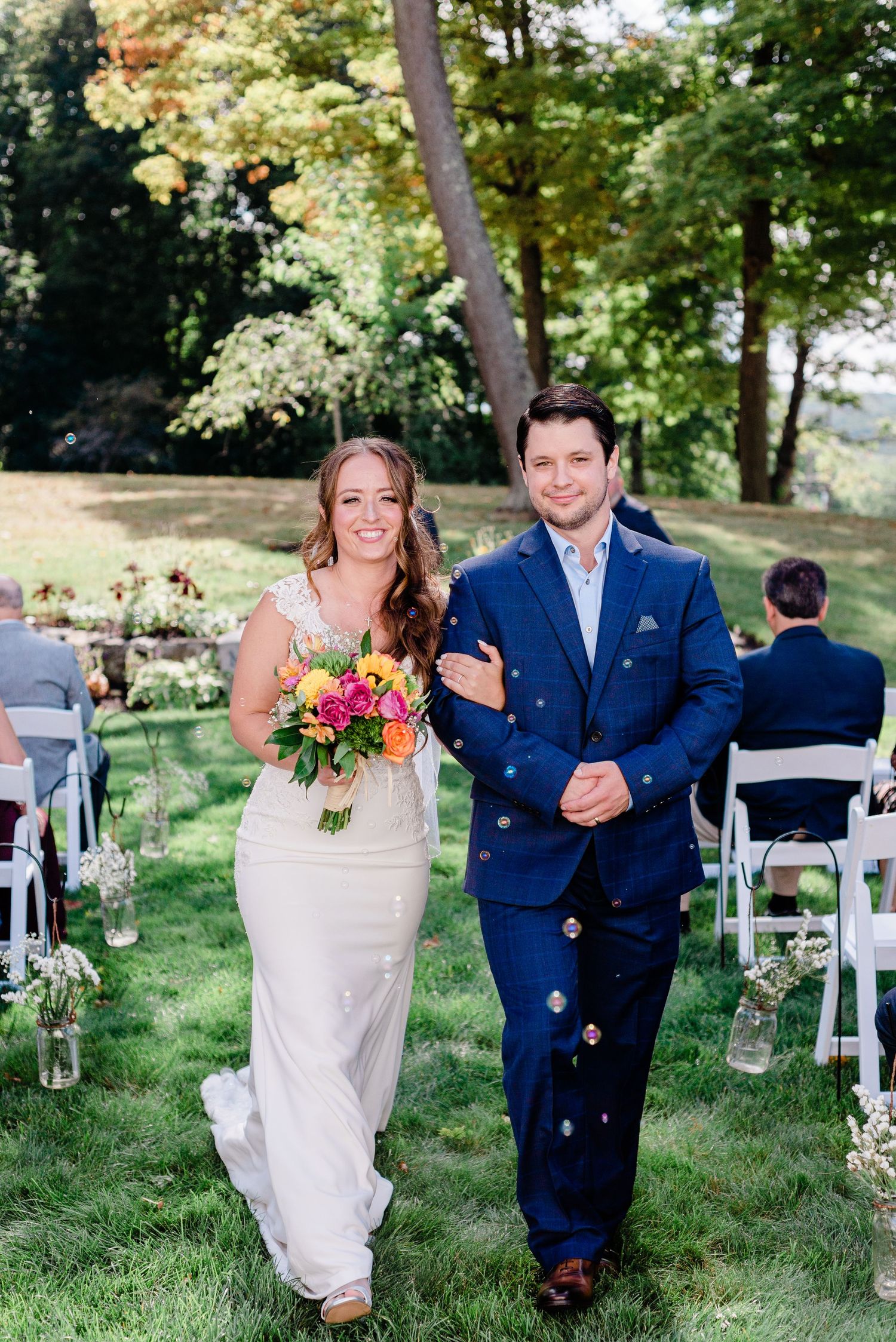 a bride and groom walk down the aisle as man and wife