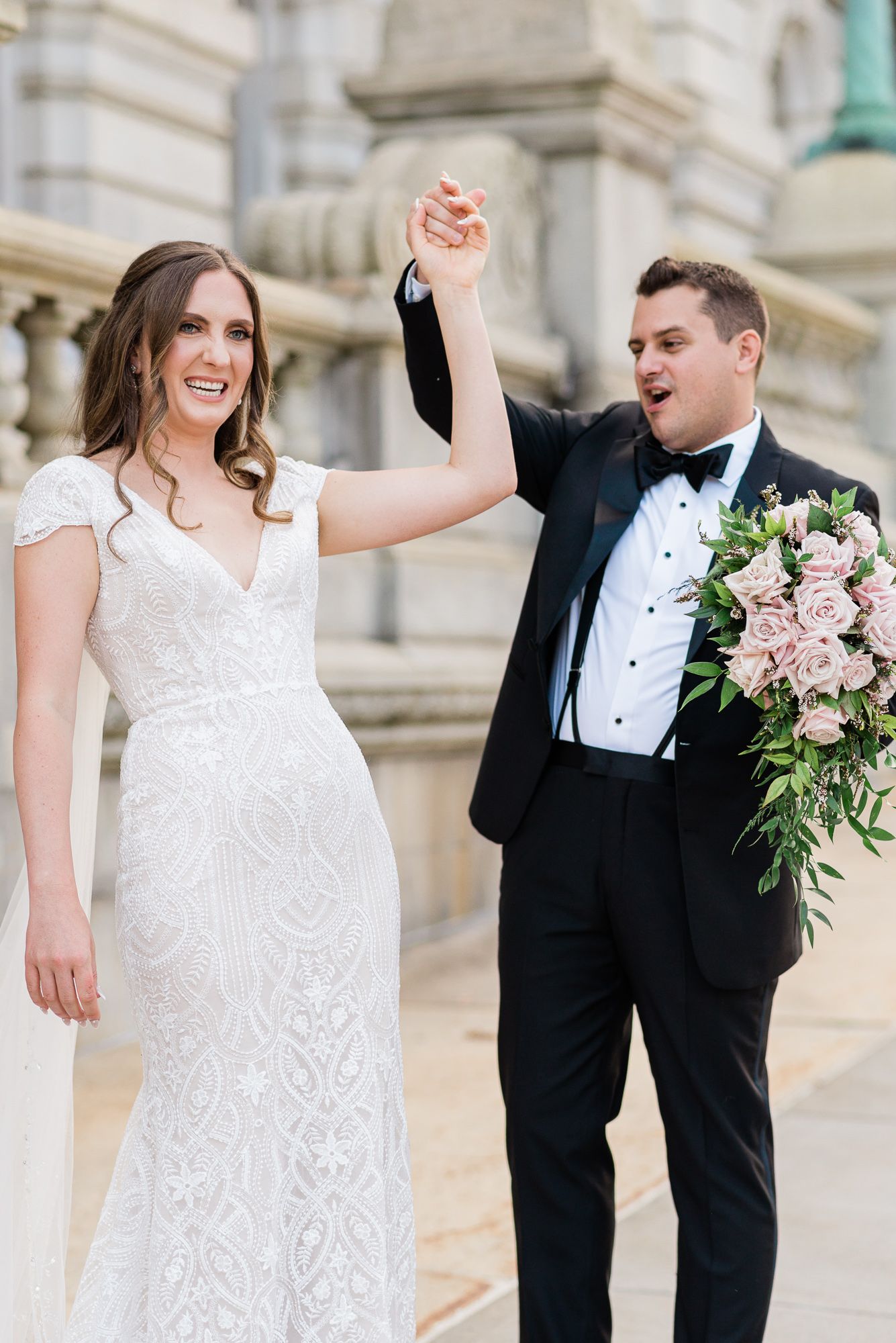 Groom is spinning his bride during their first look ceremony.