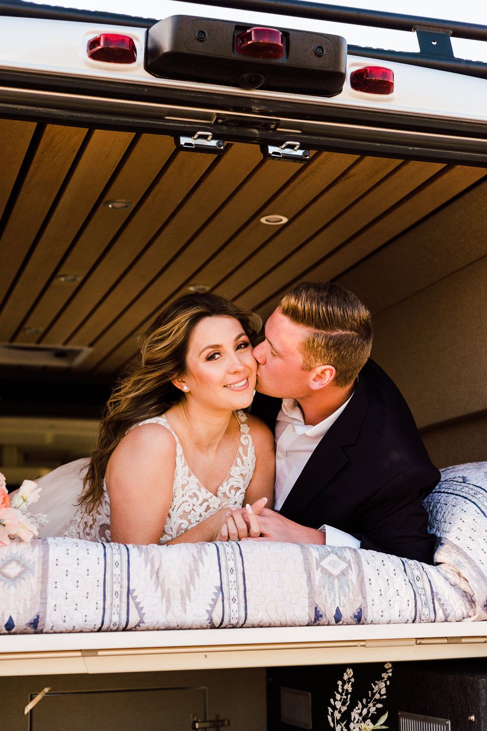 an elopement couple kiss in a camper van