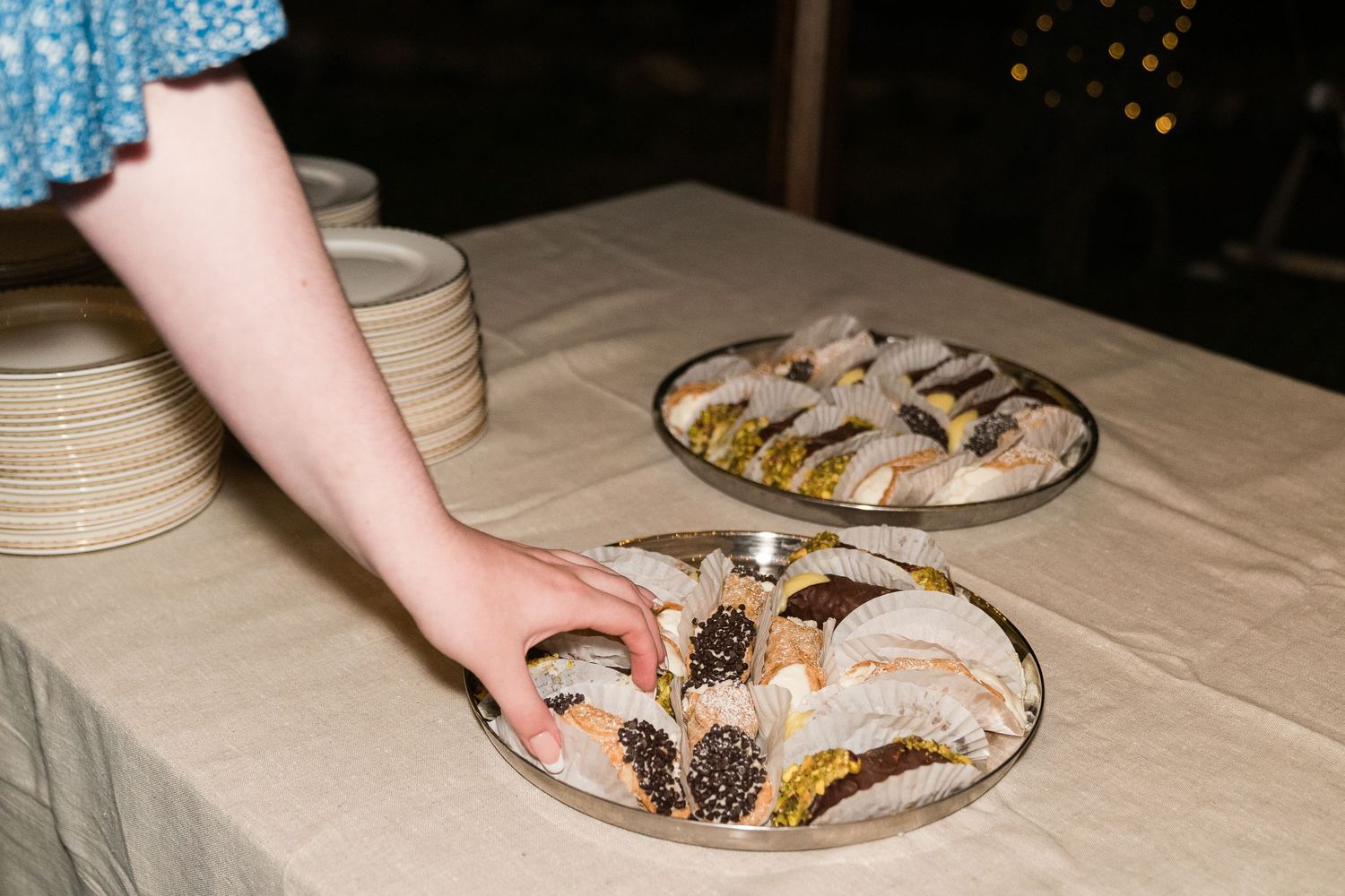 a wedding guest grabs a cannoli