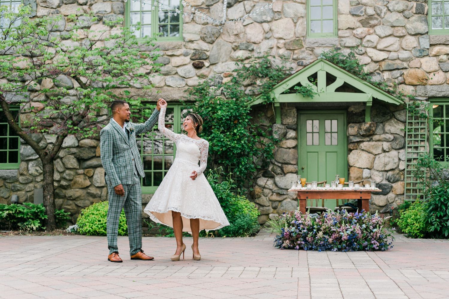 Bride and groom dancing in a garden elopement photo.