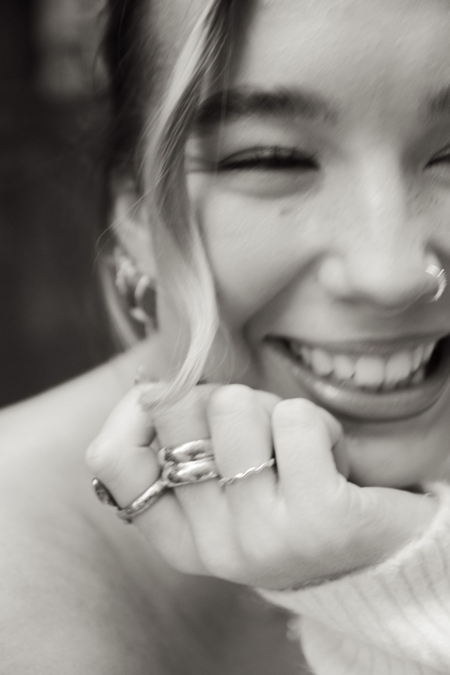Black and white close-up shots showing joyful expressions and wedding rings.