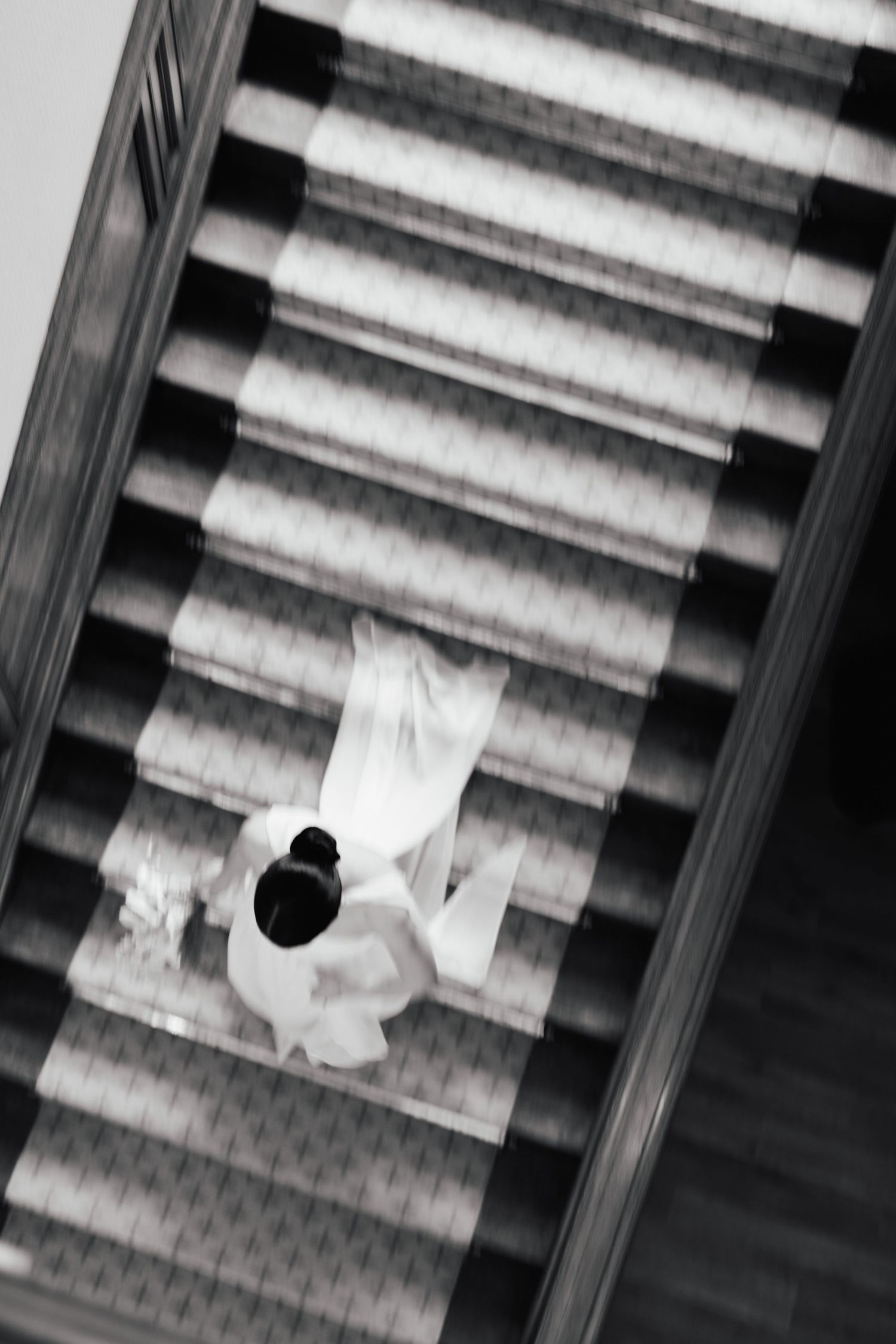A series of five black and white architectural photographs showing abstract geometric patterns of a building structure.