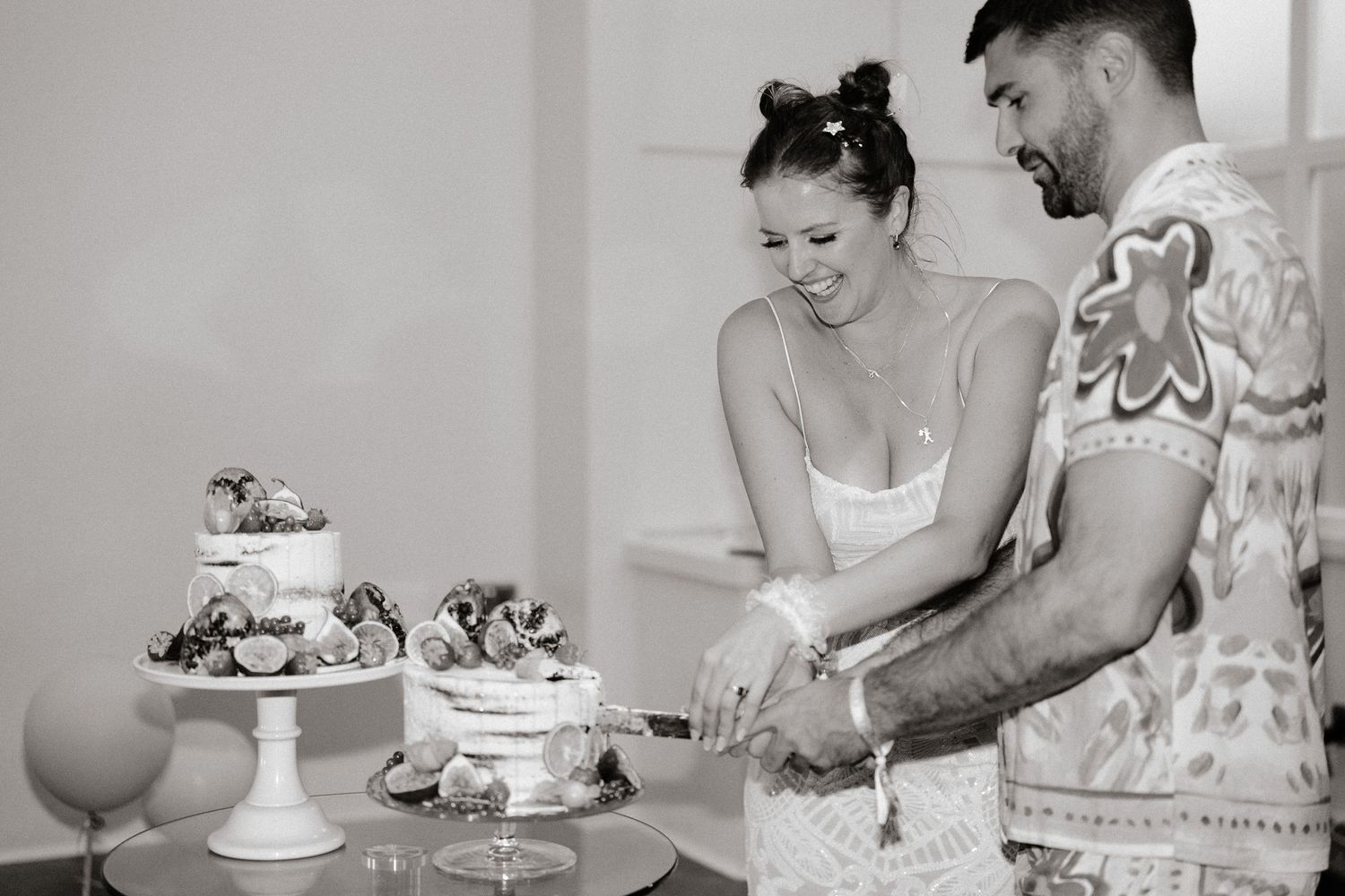Black and white sequence showing couple enjoying dessert and drinks indoors.