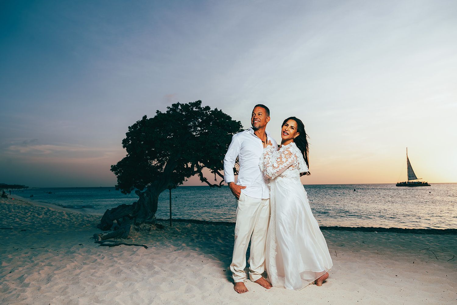Couple walking together on Eagle Beach Aruba at sunset