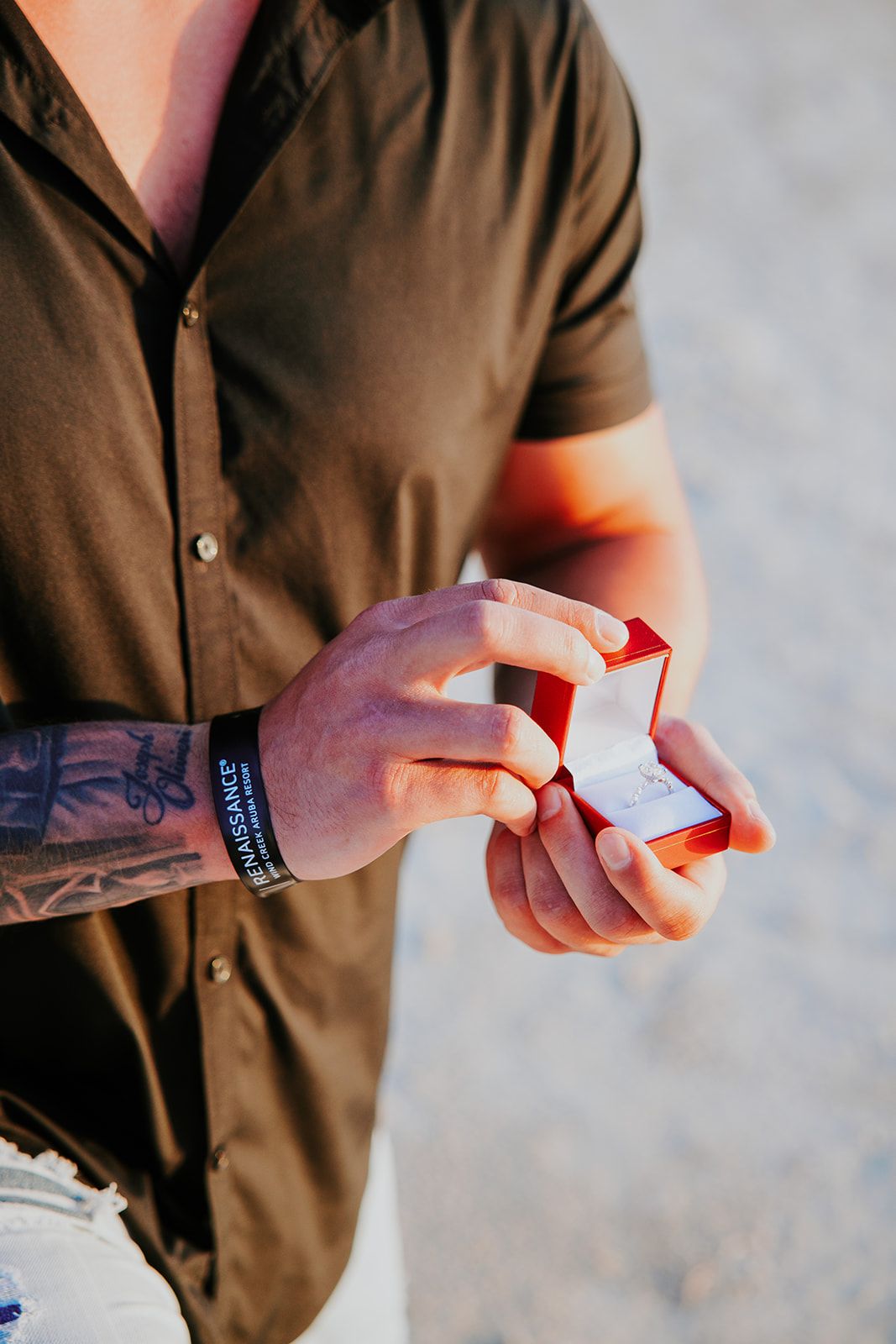 Close-up sequence of hands holding and flipping through a red deck of playing cards.