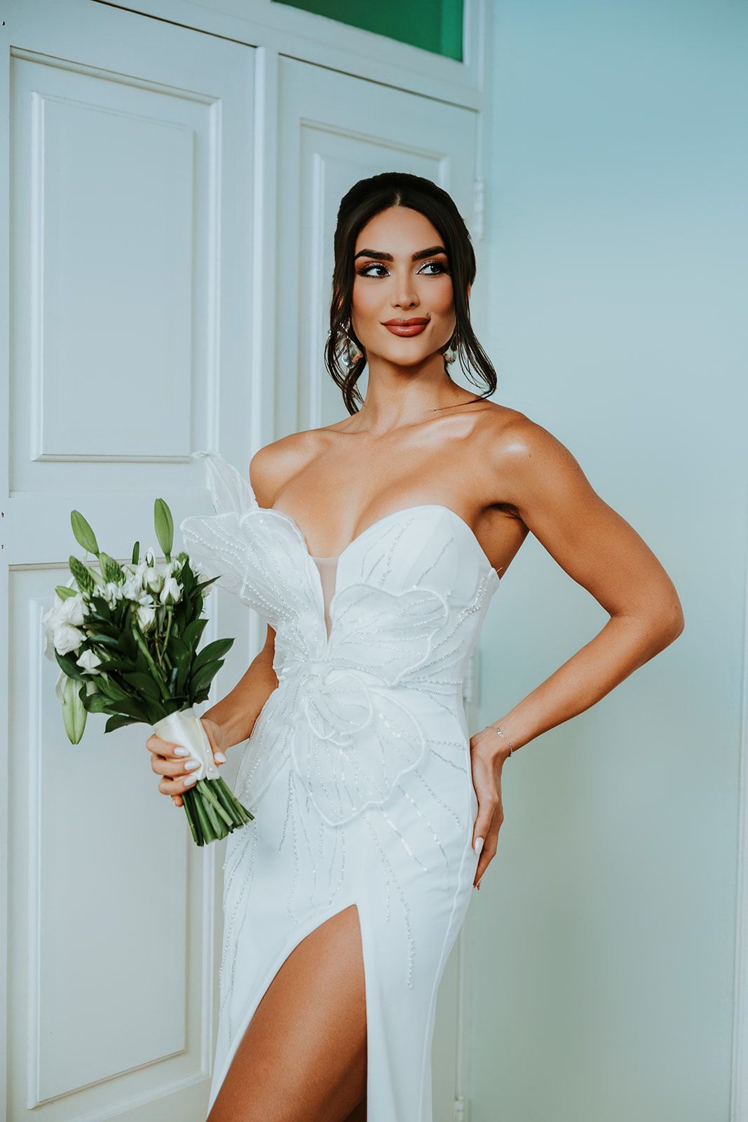 A series of four bridal photos showing a white strapless wedding dress with floral details and a bouquet.