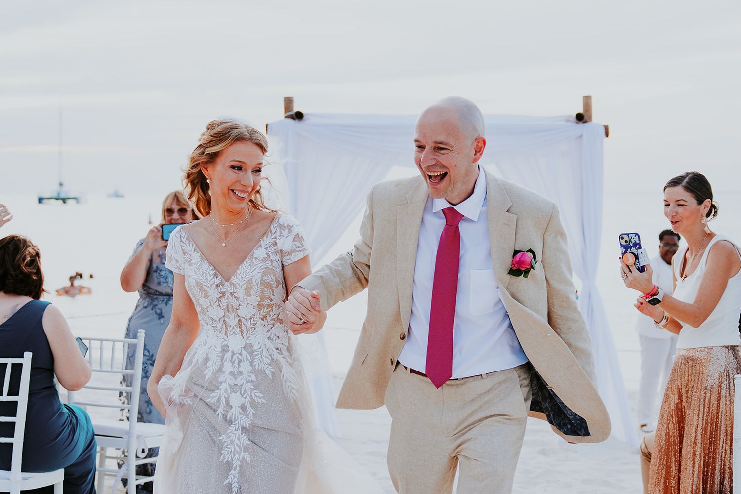 A sequence of candid wedding reception moments showing dancing and celebration in a bright indoor venue.