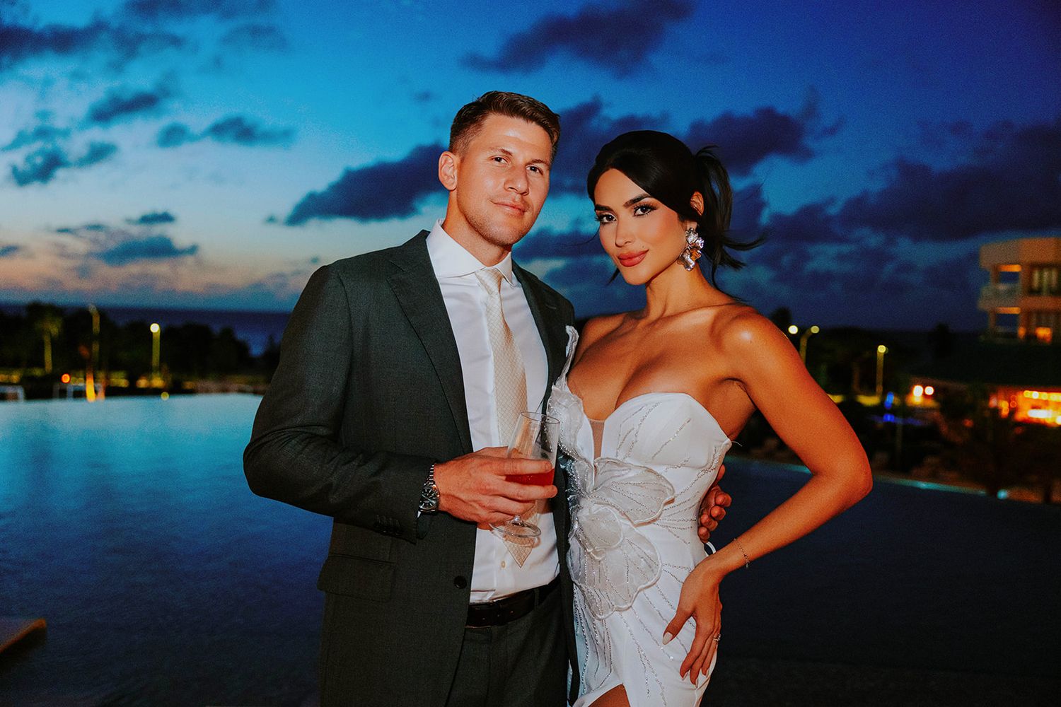 Destination wedding couple embracing on Eagle Beach Aruba