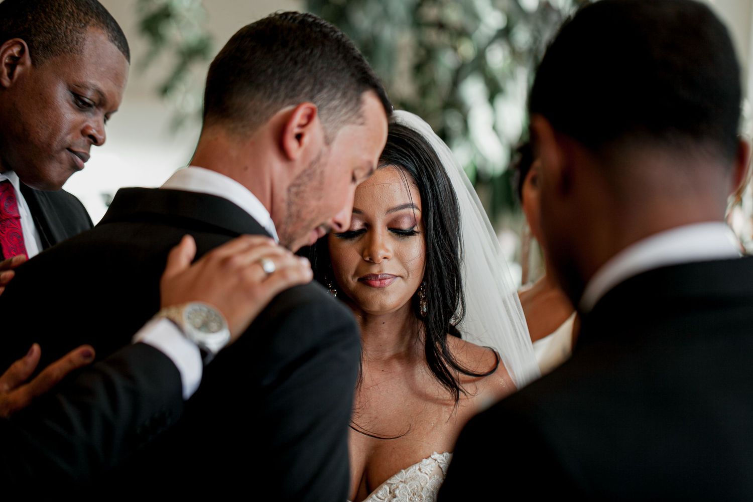 Candid emotional moment between bride and groom at a Trinidad wedding by Charles Parris