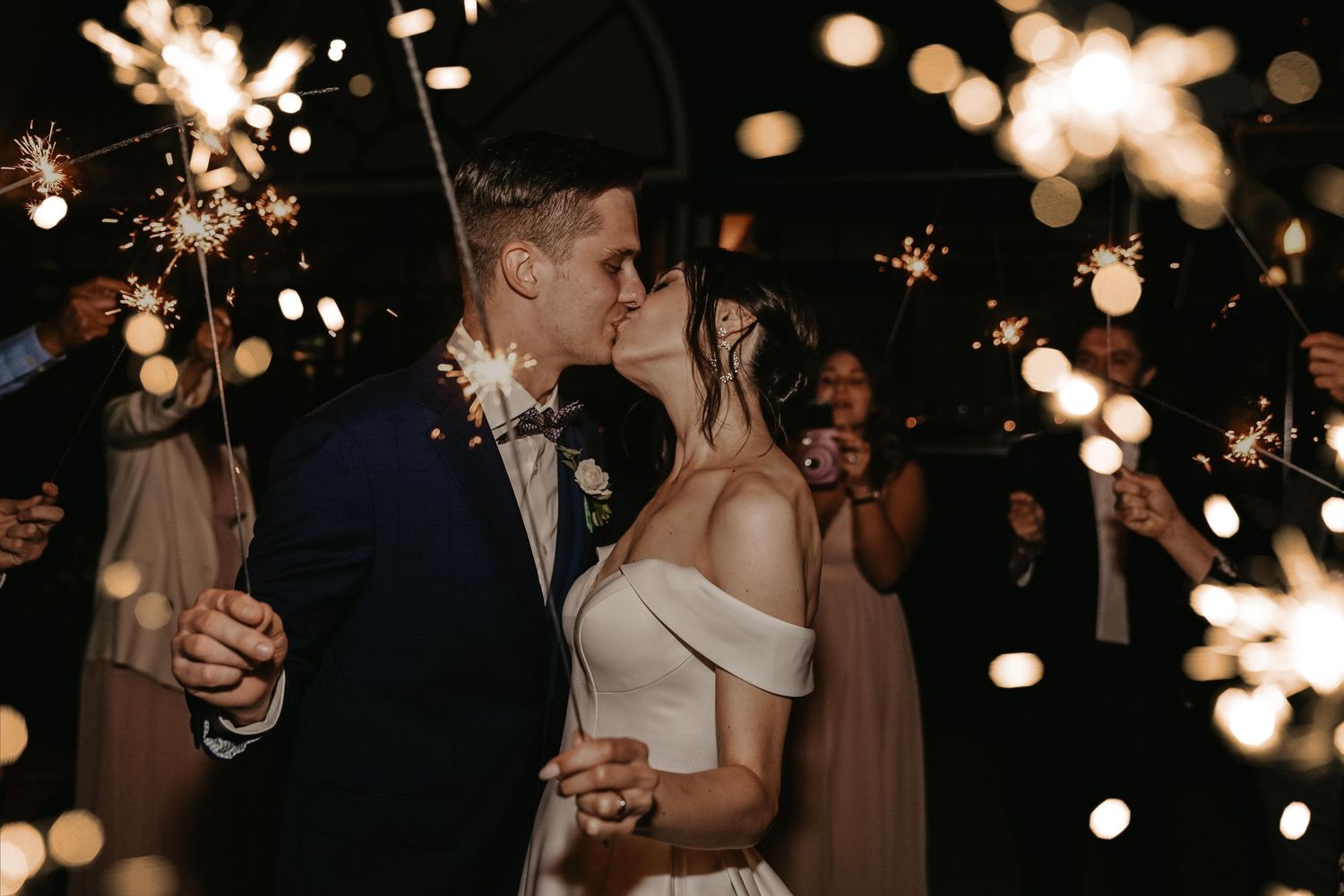 Romantic wedding dance scene with glowing bokeh lights creating a magical atmosphere.