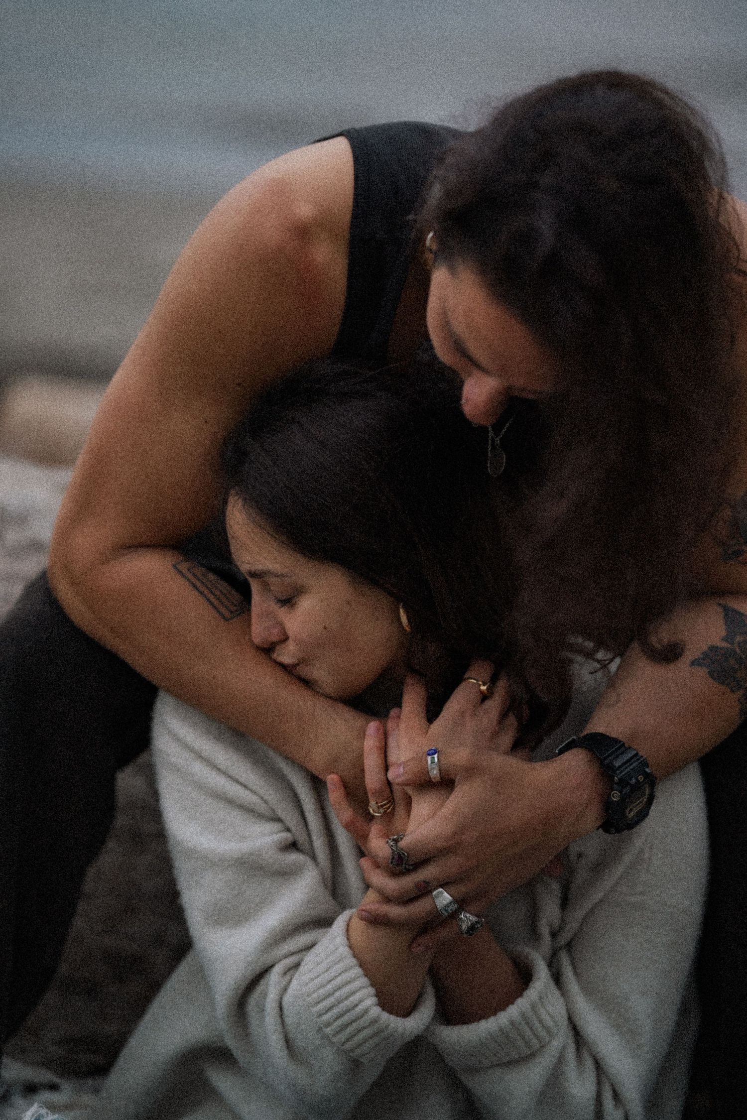 A sequence showing tender moments between a couple in muted lighting.