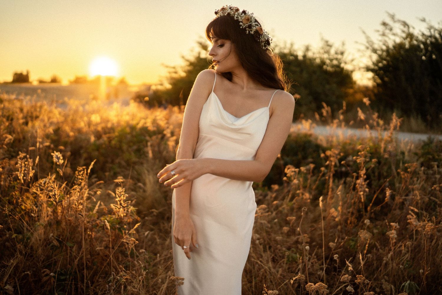 Golden hour portrait sequence in a wildflower field with warm sunset lighting.