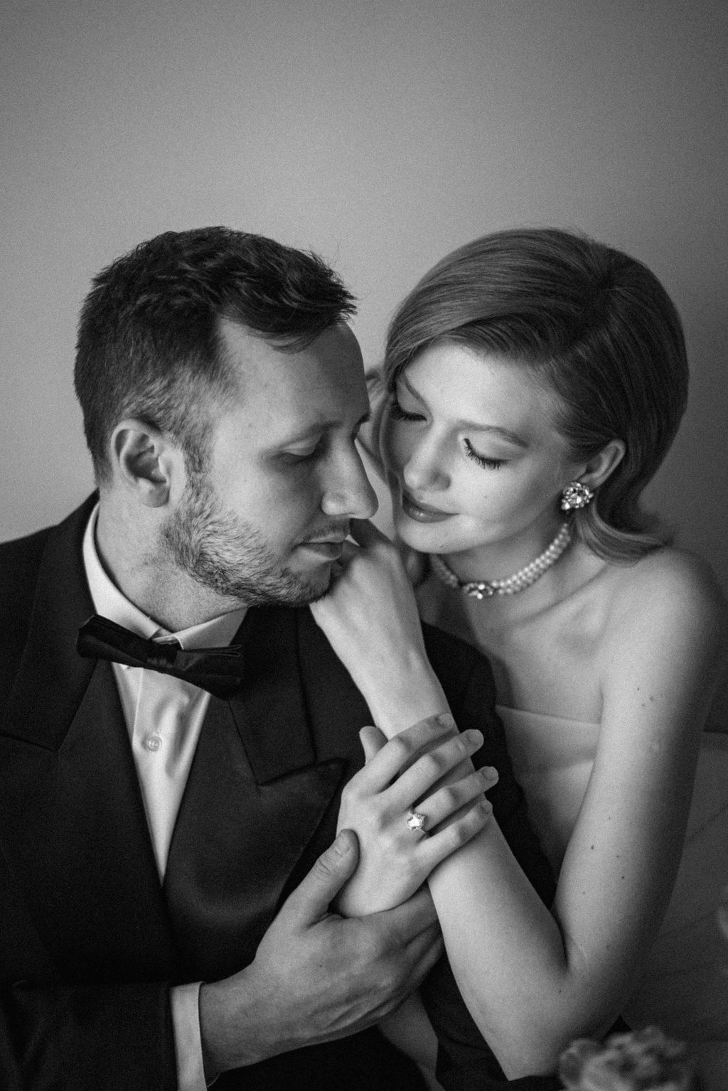Dramatic black and white romantic portrait with elegant formal attire.