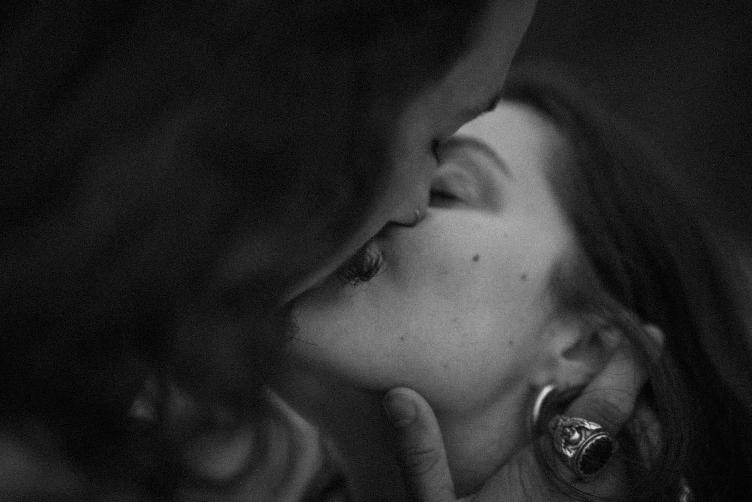 A dramatic black and white close-up sequence of an intimate moment.