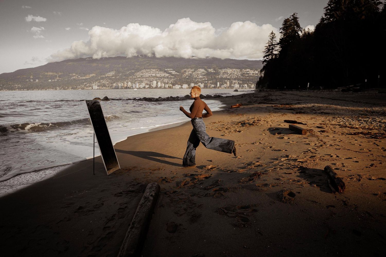 A sequence of beach photos shows someone jumping and leaping along a stormy coastline at sunset.