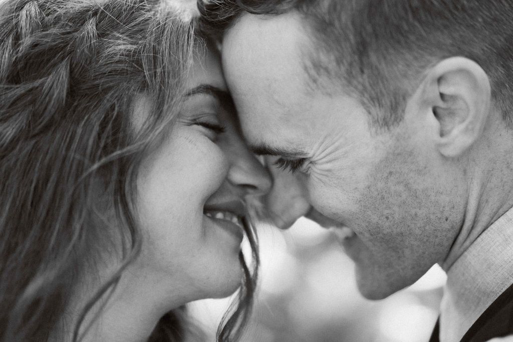 Intimate black and white close-up portraits showing tender moments.