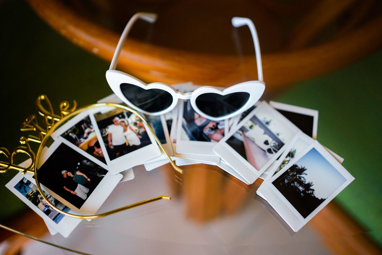 Vintage style polaroid photos hanging from string lights with a nostalgic feel.