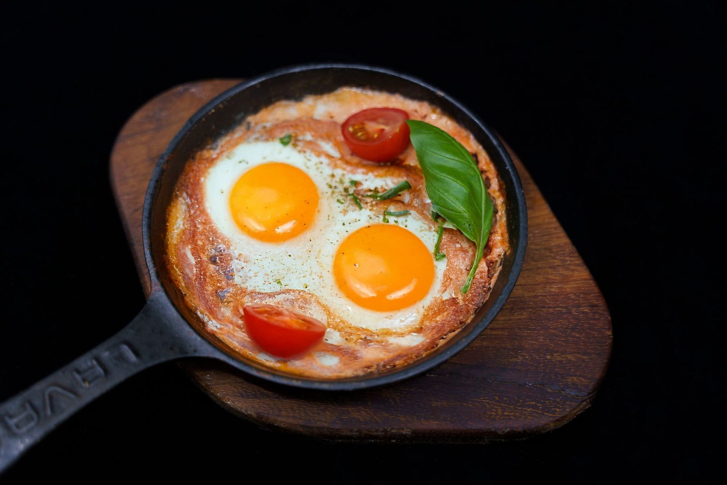 Pumparela Restaurant Fried eggs with tomato sauce, mozzarella and grana padano.