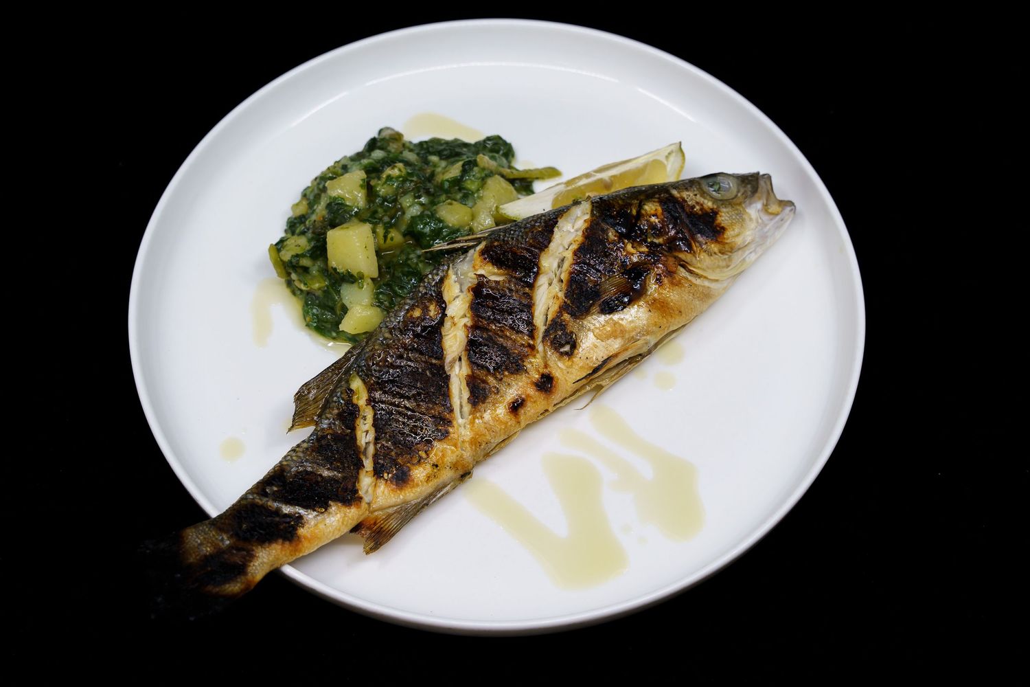 Pumparela Restaurant  Portion of white fish with boiled potatoes and chards