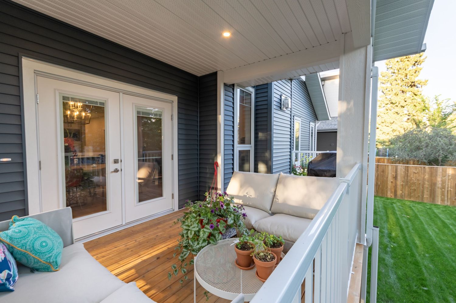 Evening HDR image of rear deck patio on blue and white bungalow home Central Alberta Real Estate Media David Spence Photography