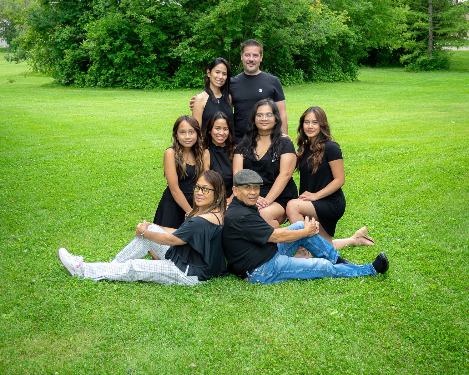 Central Alberta Real Estate Media David Spence Photography large Filipino family posed geometrically on a park lawn in summer