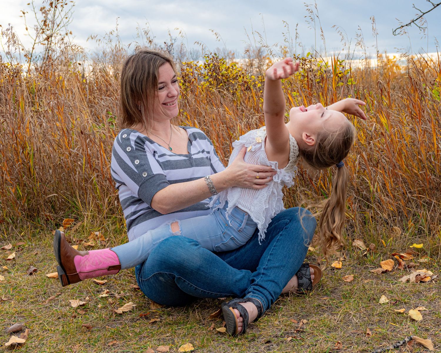 Central Alberta Real Estate Media David Spence Photography Woman and child enjoying portraits near a field of tall grass