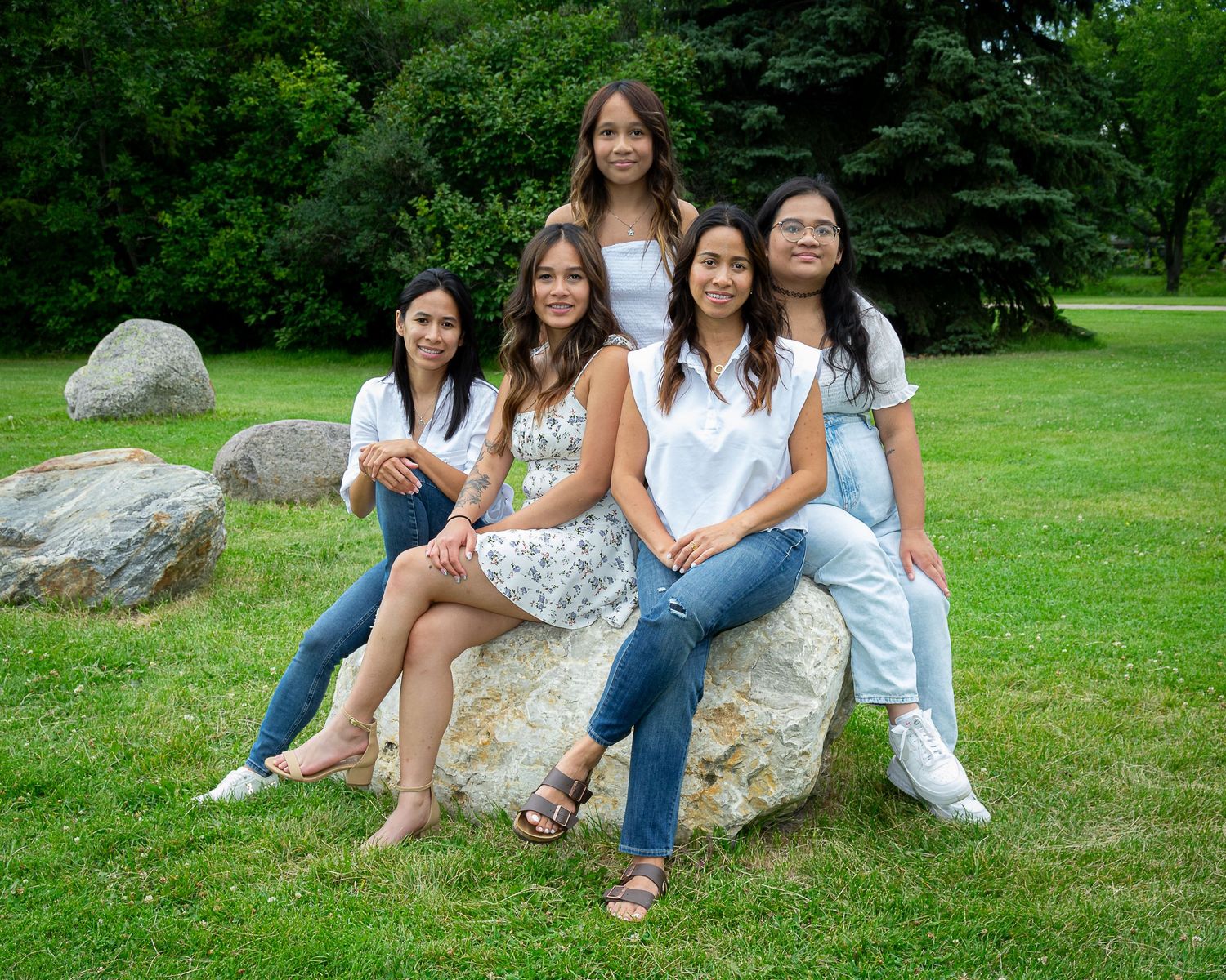 Central Alberta Real Estate Media David Spence Photography   group of women posed on a large rock in a Red Deer park