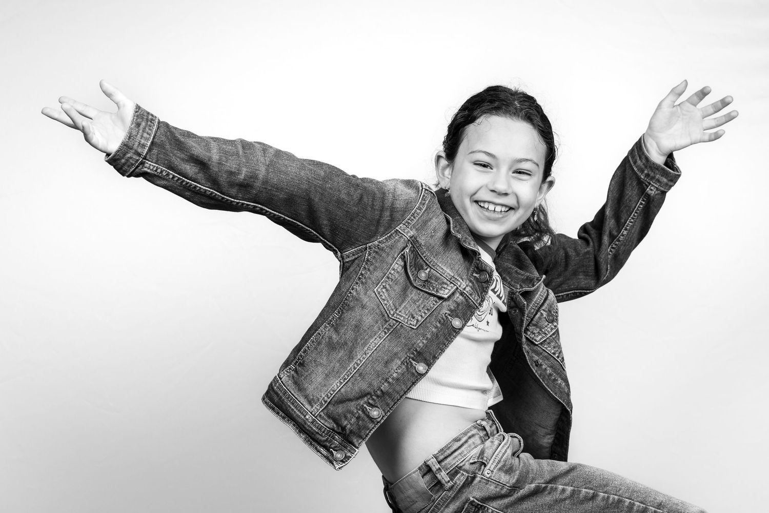 Child having a fun pose in black and white