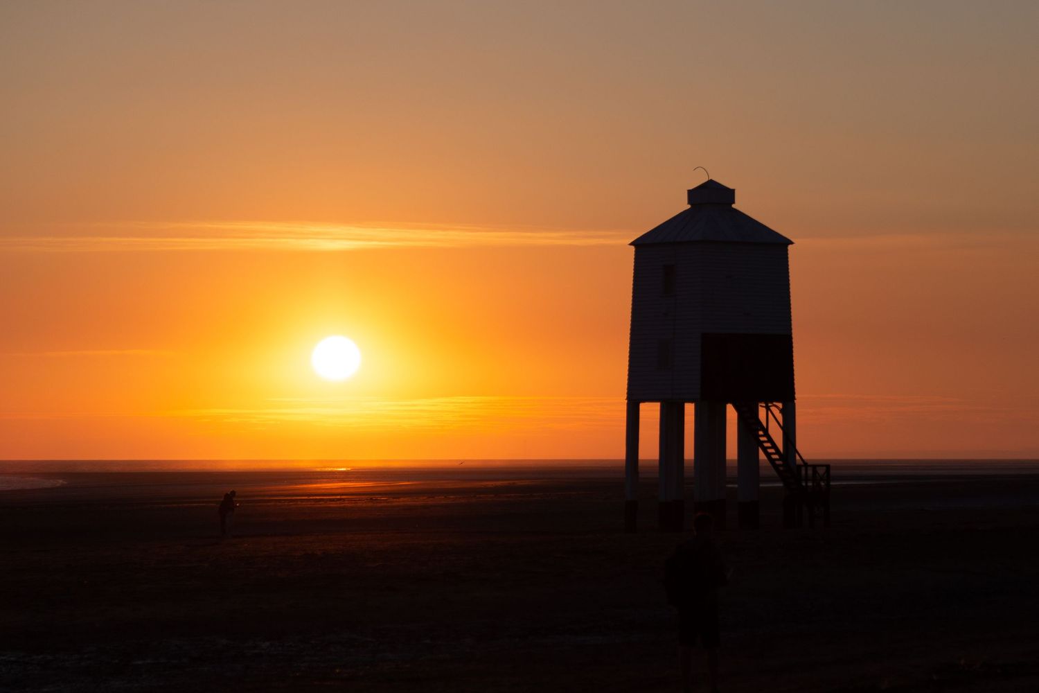 Burnham-on-Sea lighthouse on the beach at sunset overlooking the Bristol Channel, Somerset