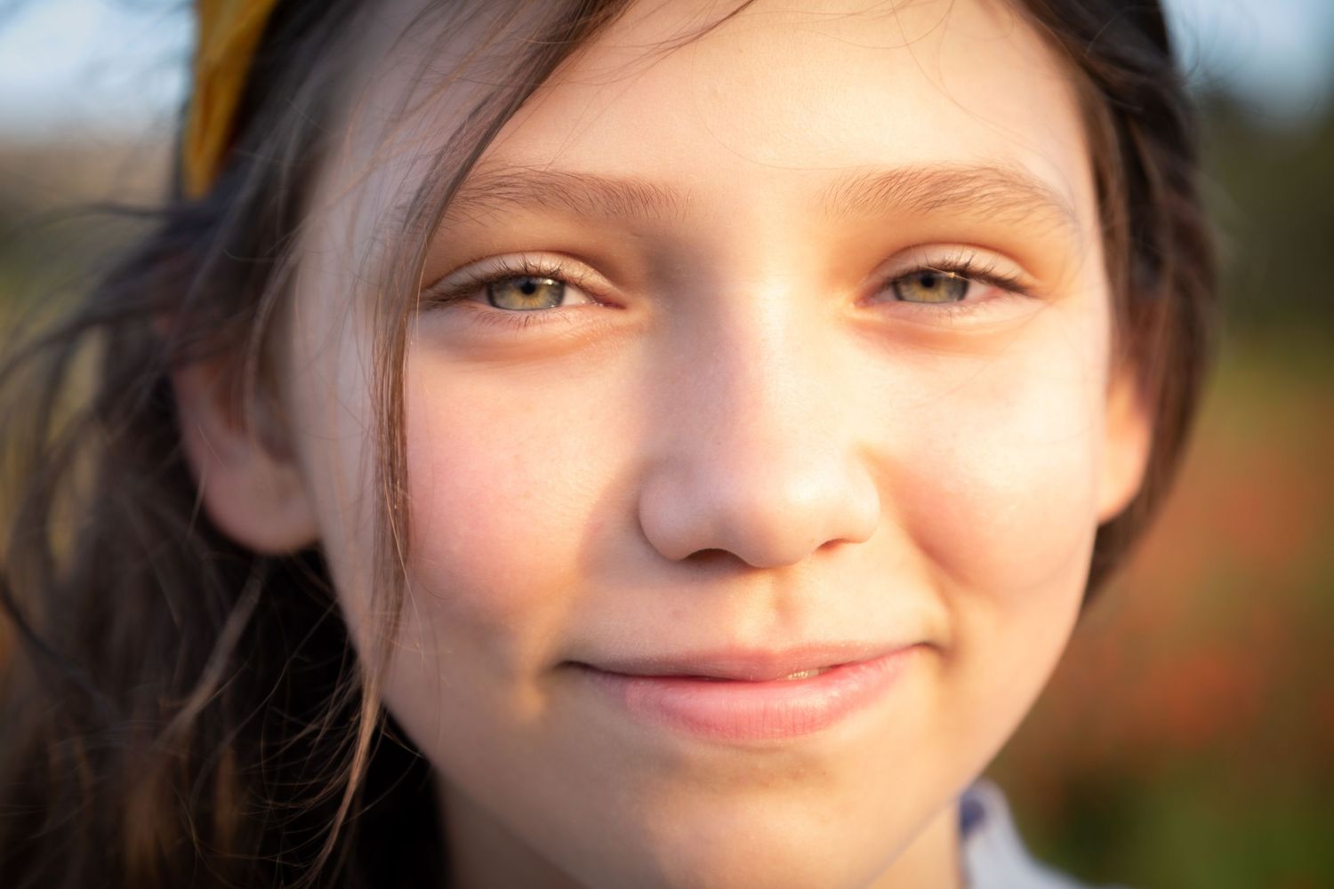 Close-up outdoor portrait of a young girl with soft natural light, Bristol photography