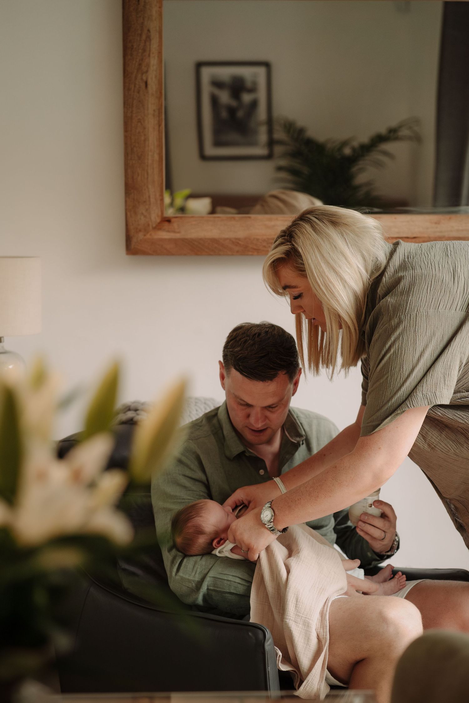 Intimate indoor lifestyle photography session on a cozy couch.