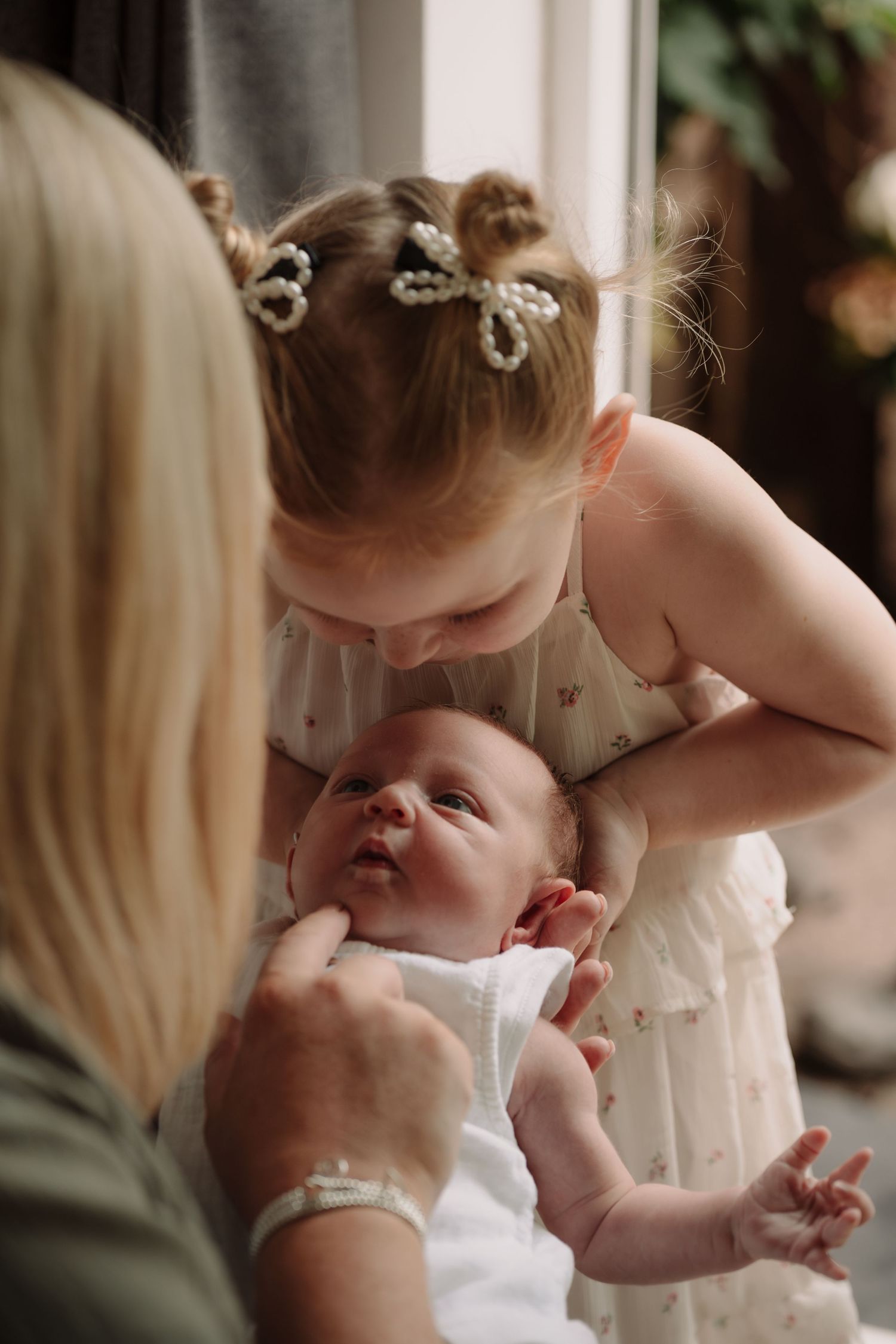 Sweet indoor photography session capturing intimate family moments.