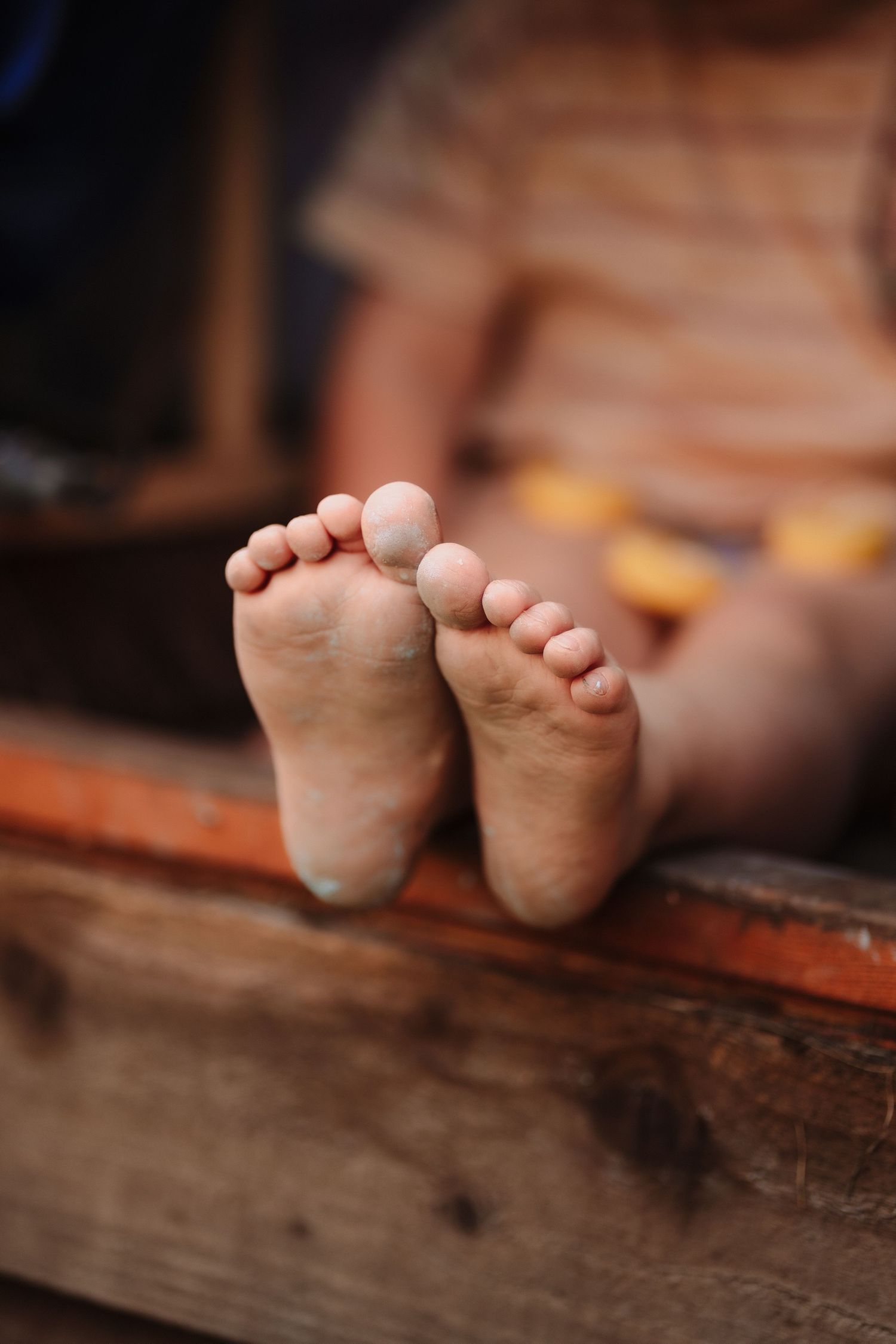 Muddy toes of a little child during a family photo session in Tamworth.