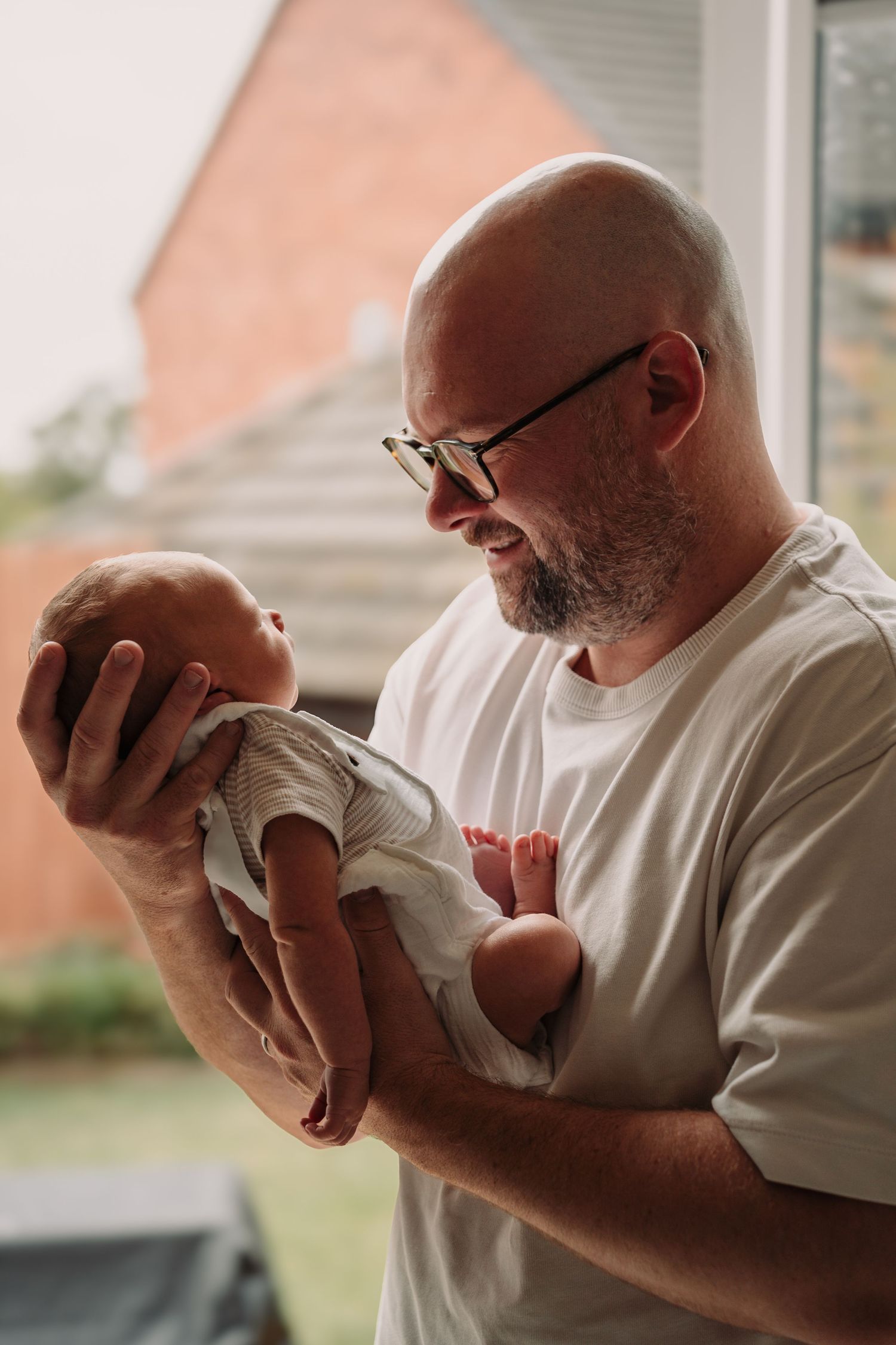 Emotional sequence of parent holding and bonding with newborn.