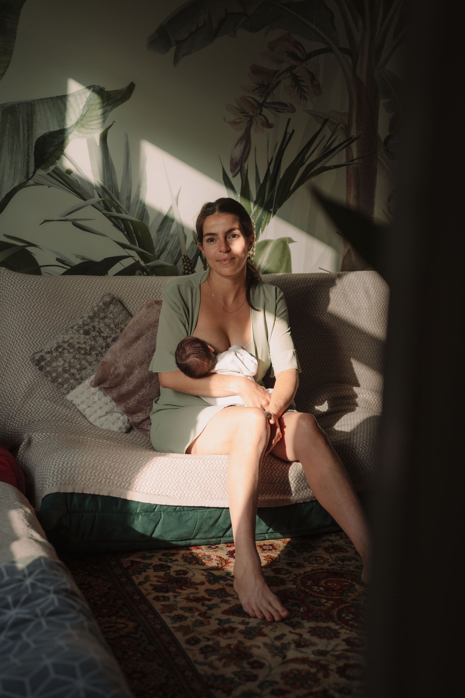 Artistic boudoir photo series showing dramatic lighting and shadows on a patterned rug in an intimate setting.
