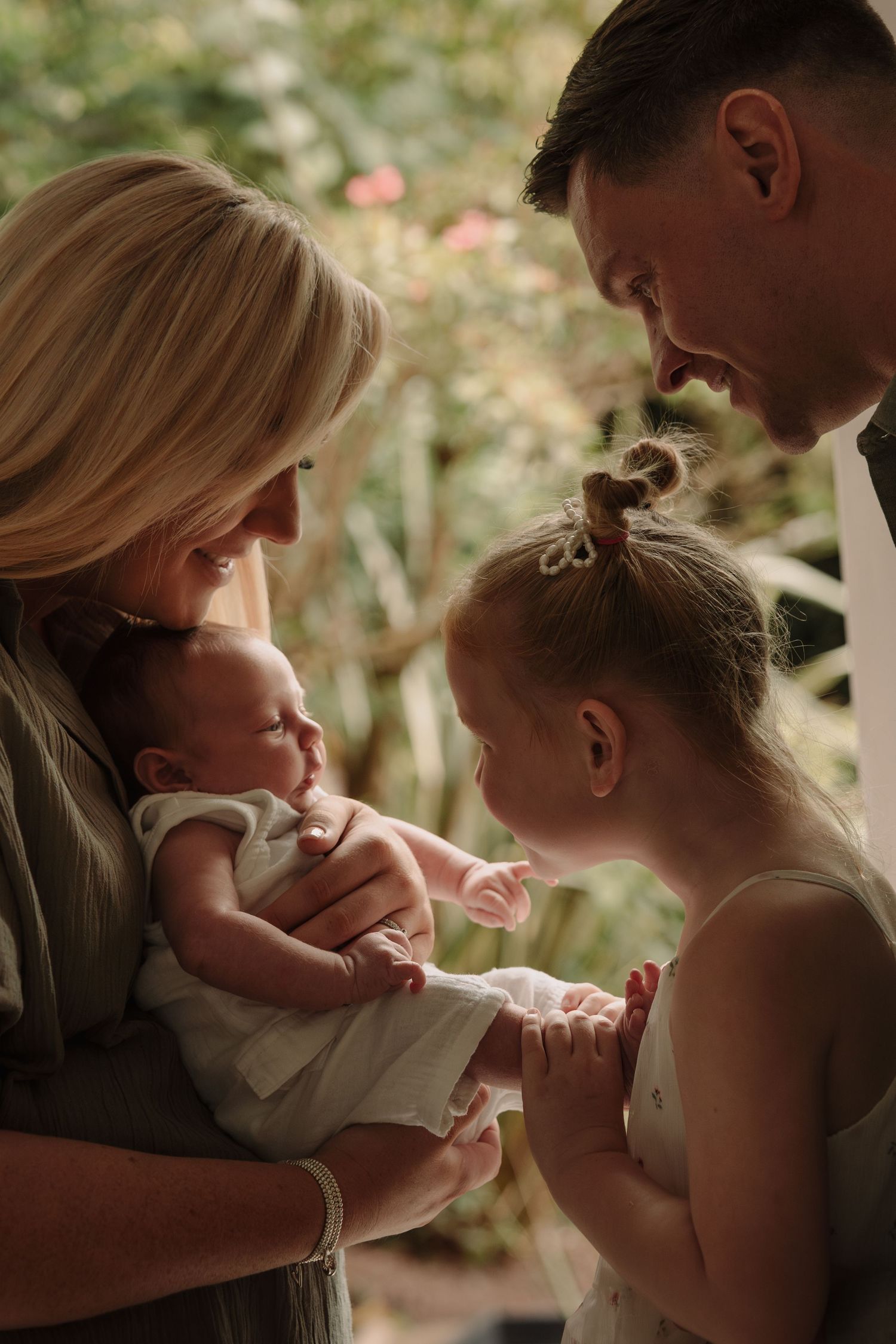 Tender family moment captured in a series of intimate outdoor portraits.