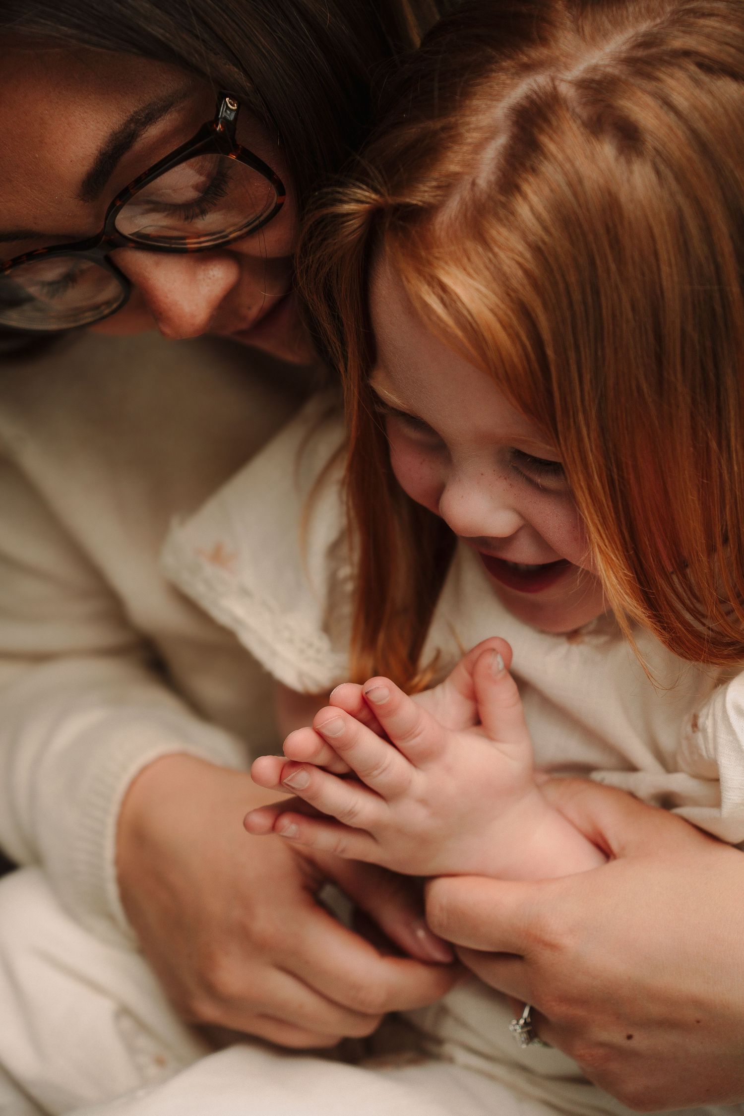 Intimate sequence of tender family moments captured in warm, close-up photography.