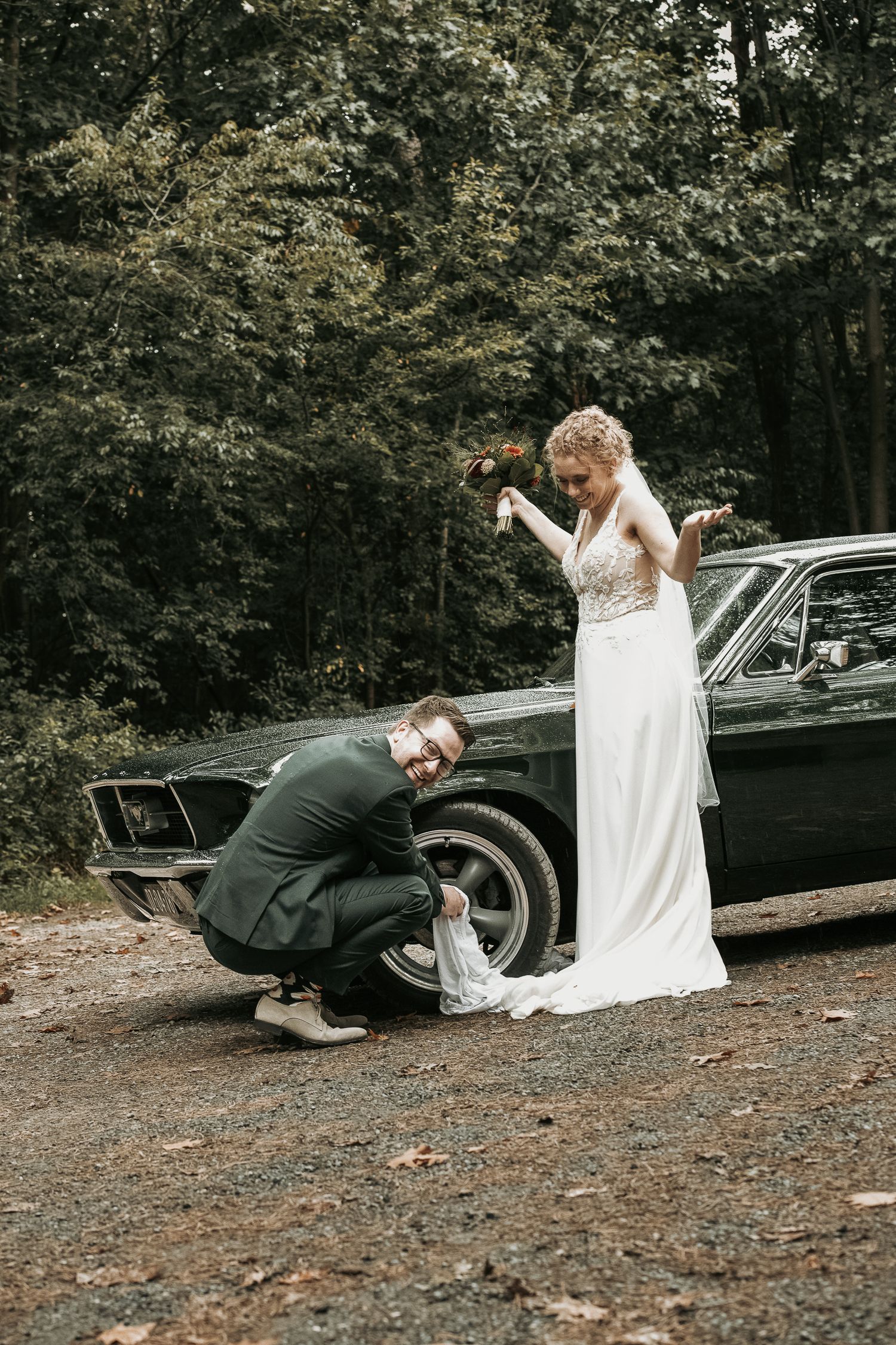 A playful sequence of wedding photos showing a couple interacting near a vintage black car in a wooded setting.