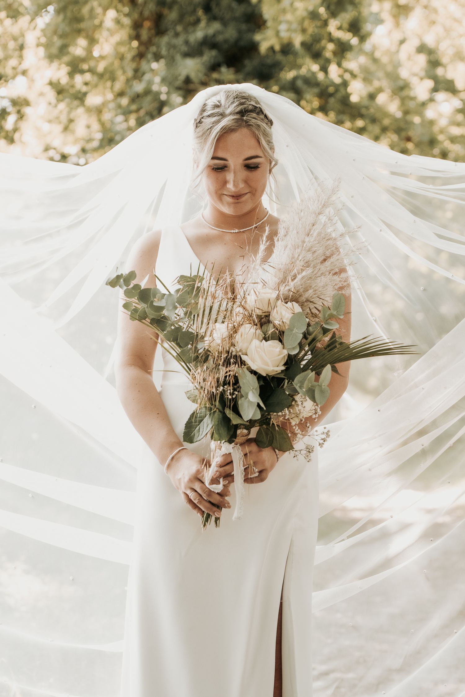 Elegant bridal portrait series showing flowing white veil and wedding bouquet with soft natural lighting in outdoor setting.