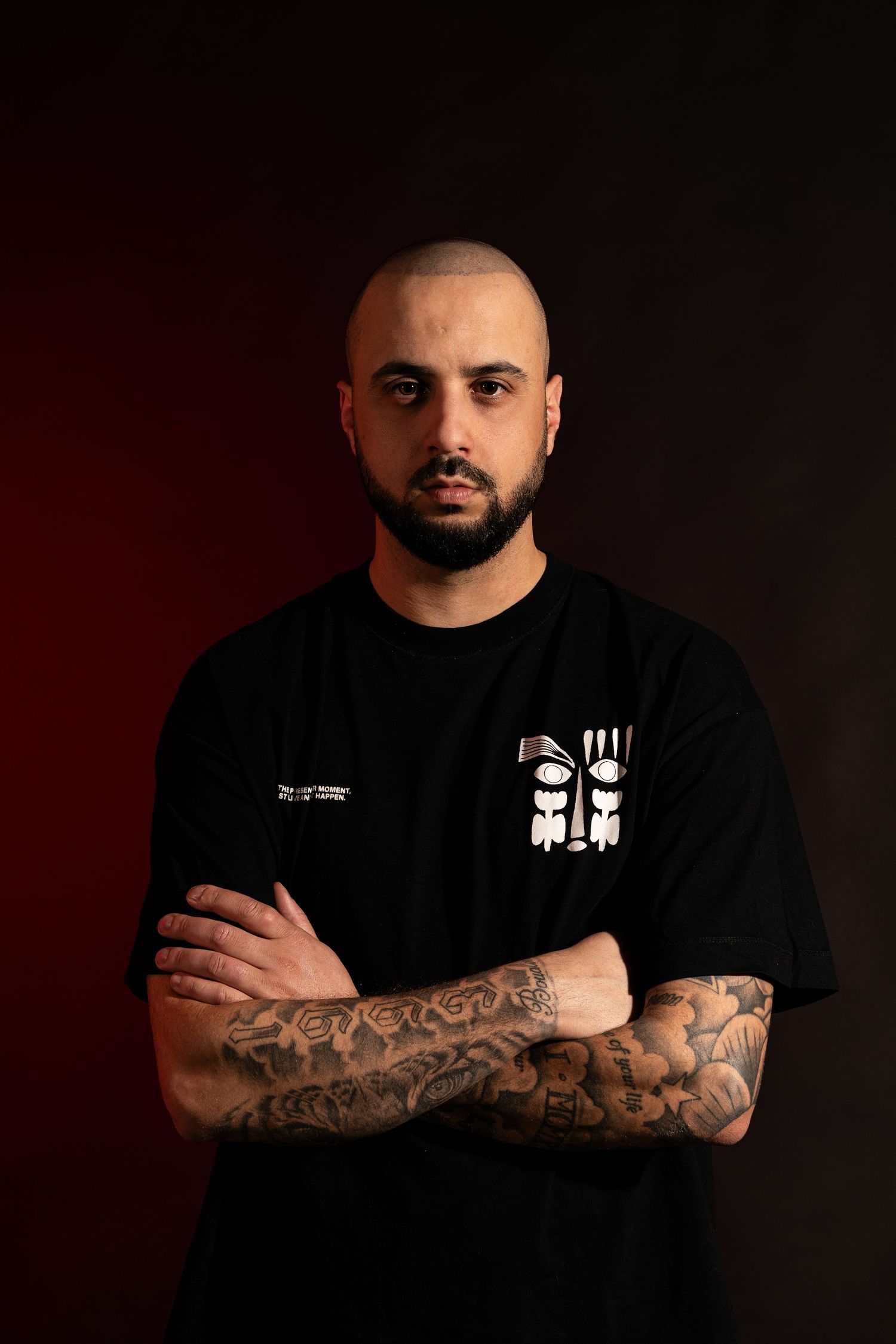 Dramatic portrait series showing a person in black clothing with tattooed arms against a dark background.