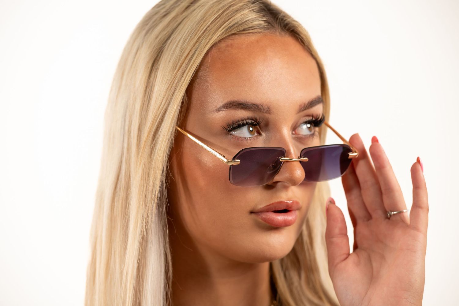 A series of four beauty shots showing blonde hair and sunglasses against a white background.