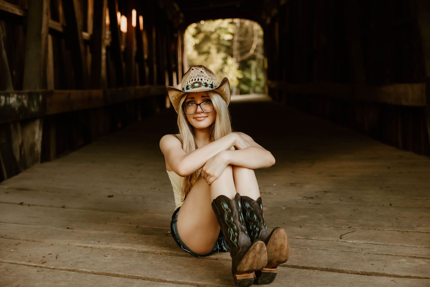 Candid indoor portraits with warm lighting and rustic wooden floor.