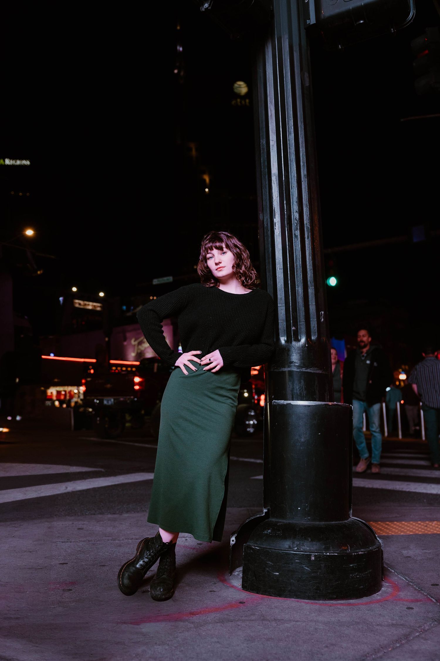 Nighttime urban photography series featuring dark silhouettes against city lights.