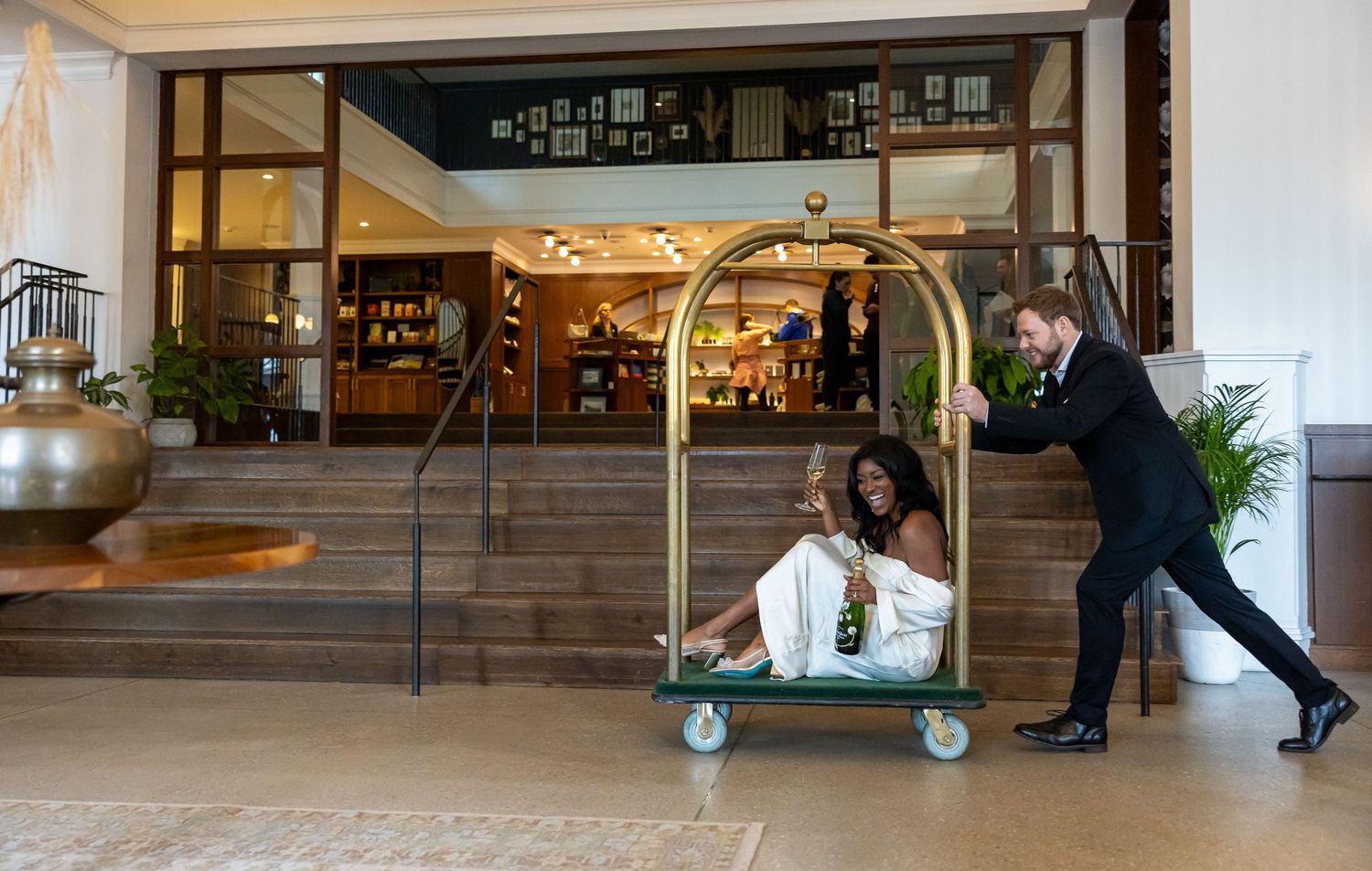 Engaged couple celebrating a fun moment at the Emeline hotel in romantic downtown Charleston, SC. days before their wedding.