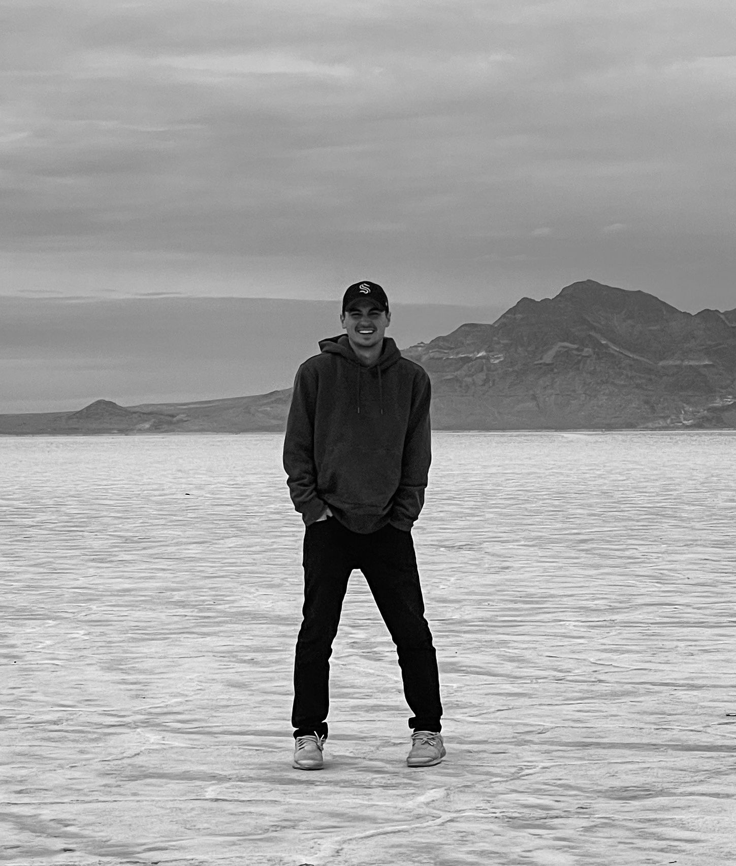 Man smiling, posing in salt flats