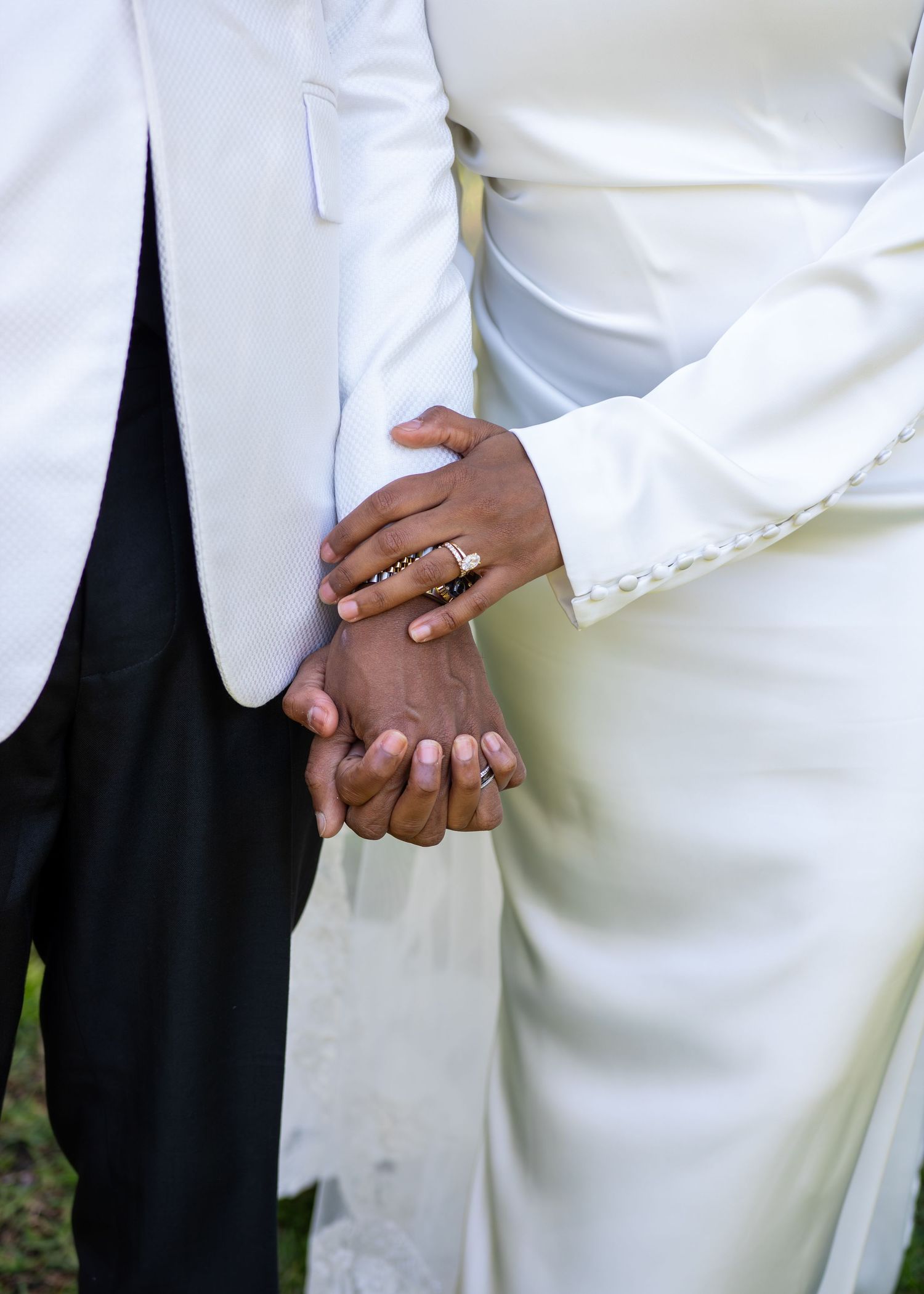 A series of cropped photos showing hands clasped together in white formal attire.