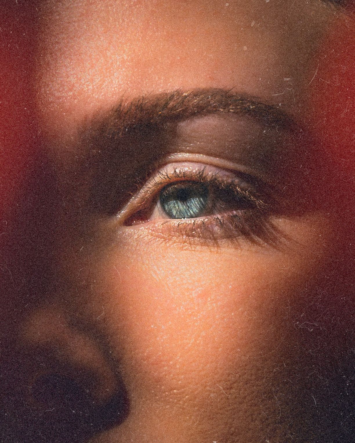 Abstract close-up portraits with dramatic red tones and artistic lighting effects.