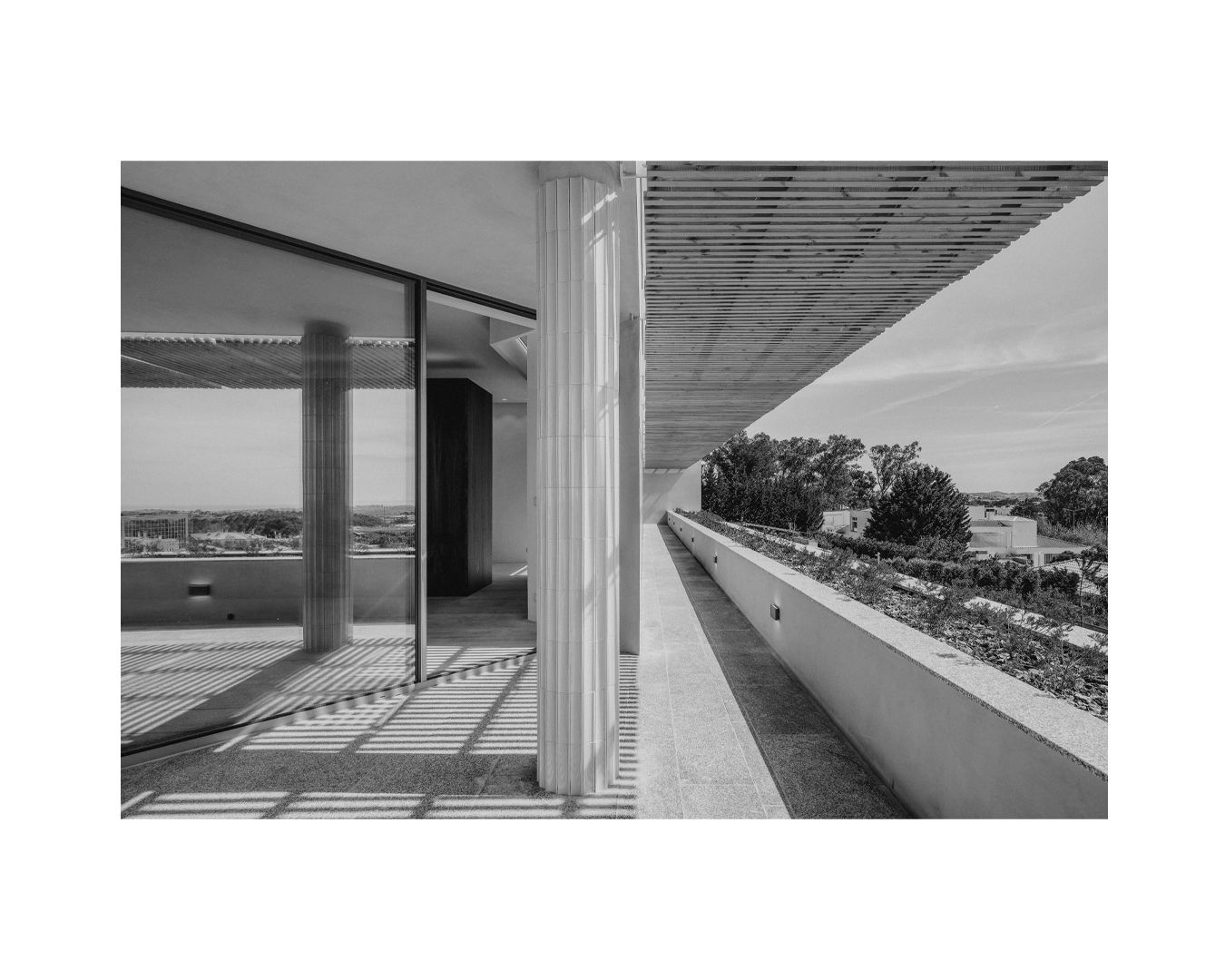 Modern minimalist architecture featuring clean lines and expansive outdoor terraces.